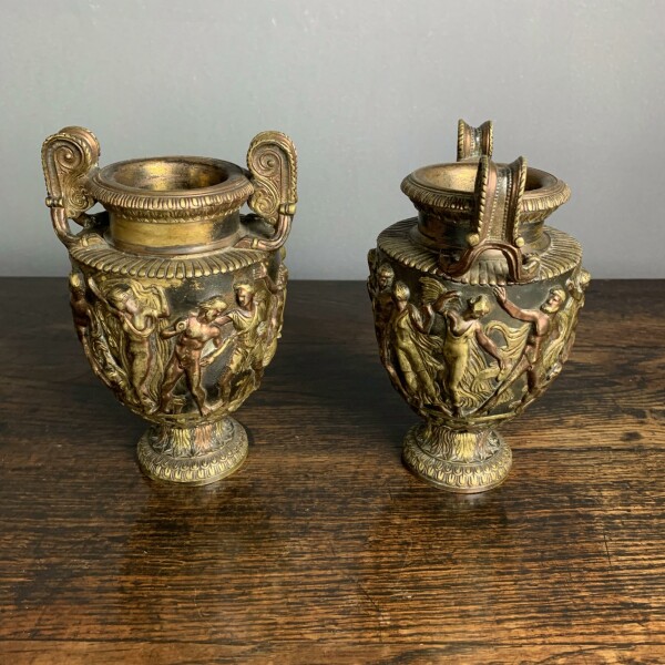 A pair of classical and decorated Gilt Urns Closeup Handle
