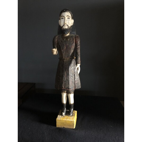 An early 18c carved figure of a bearded man