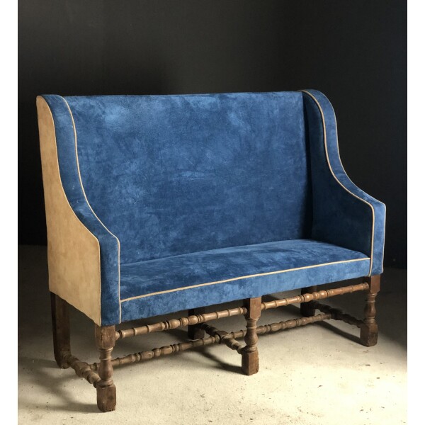 Late 17th century oak settee recovered in suede