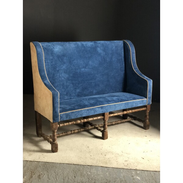 Late 17th century oak settee recovered in suede