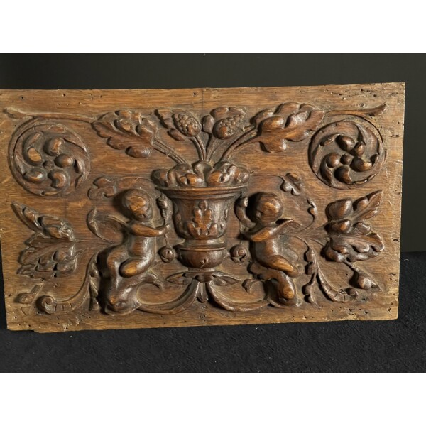 A late 17th Century Carved Oak Panel Front