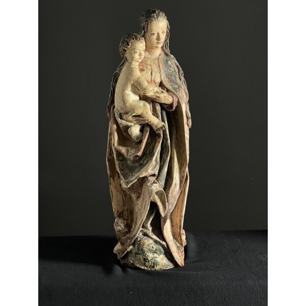 A wonderful very well carved sculpture of Madonna and child with original decoration c1600