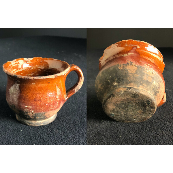 16th Century glazed cup with handle many chips Under and Standing View