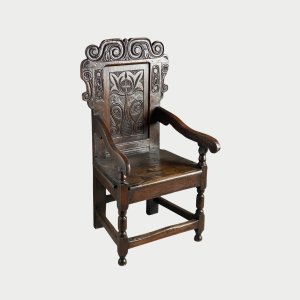 17c carved back oak armchair