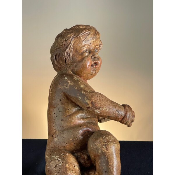 C1650 wood carving of a putti