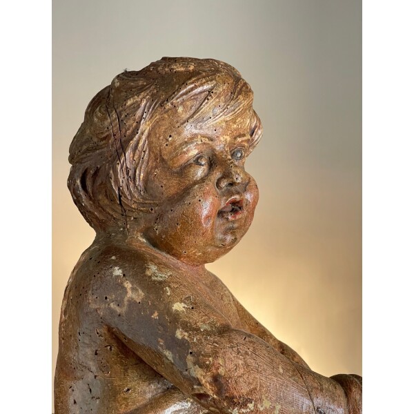C1650 wood carving of a putti