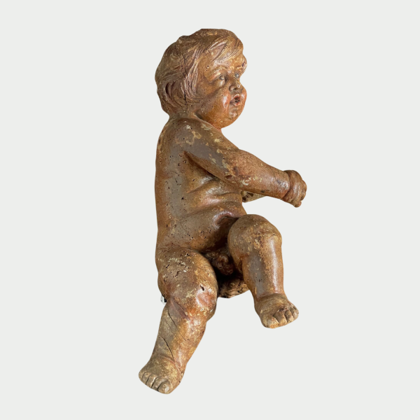 Wood carving of a putti Circa 1650