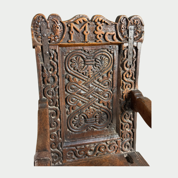 Small 17c oak childs chair very well carved and on later sledge feet